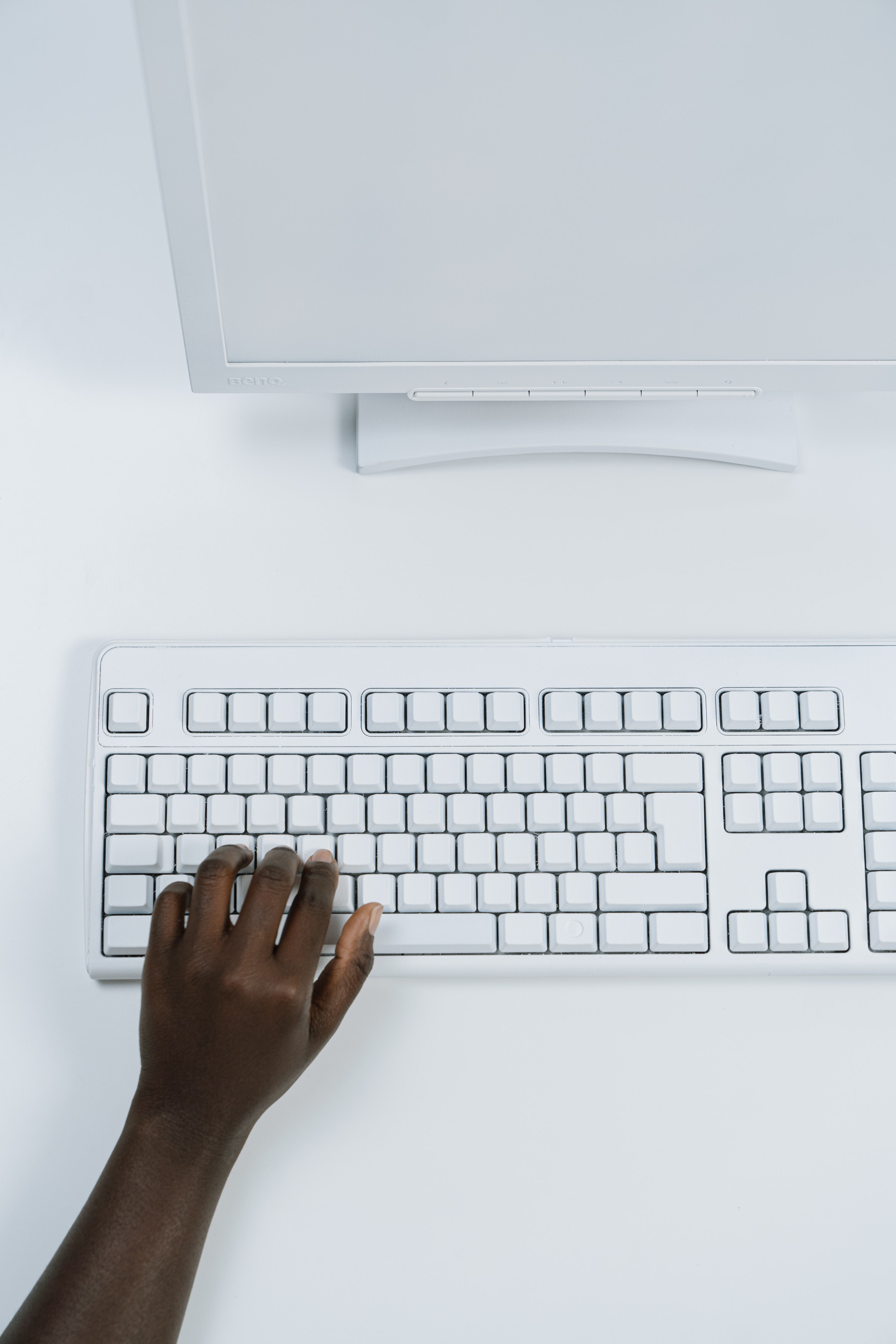 hand typing on keyboard